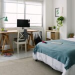 Teenager bedchamber. Bright cozy adolescent bedroom with bed and desk workplace